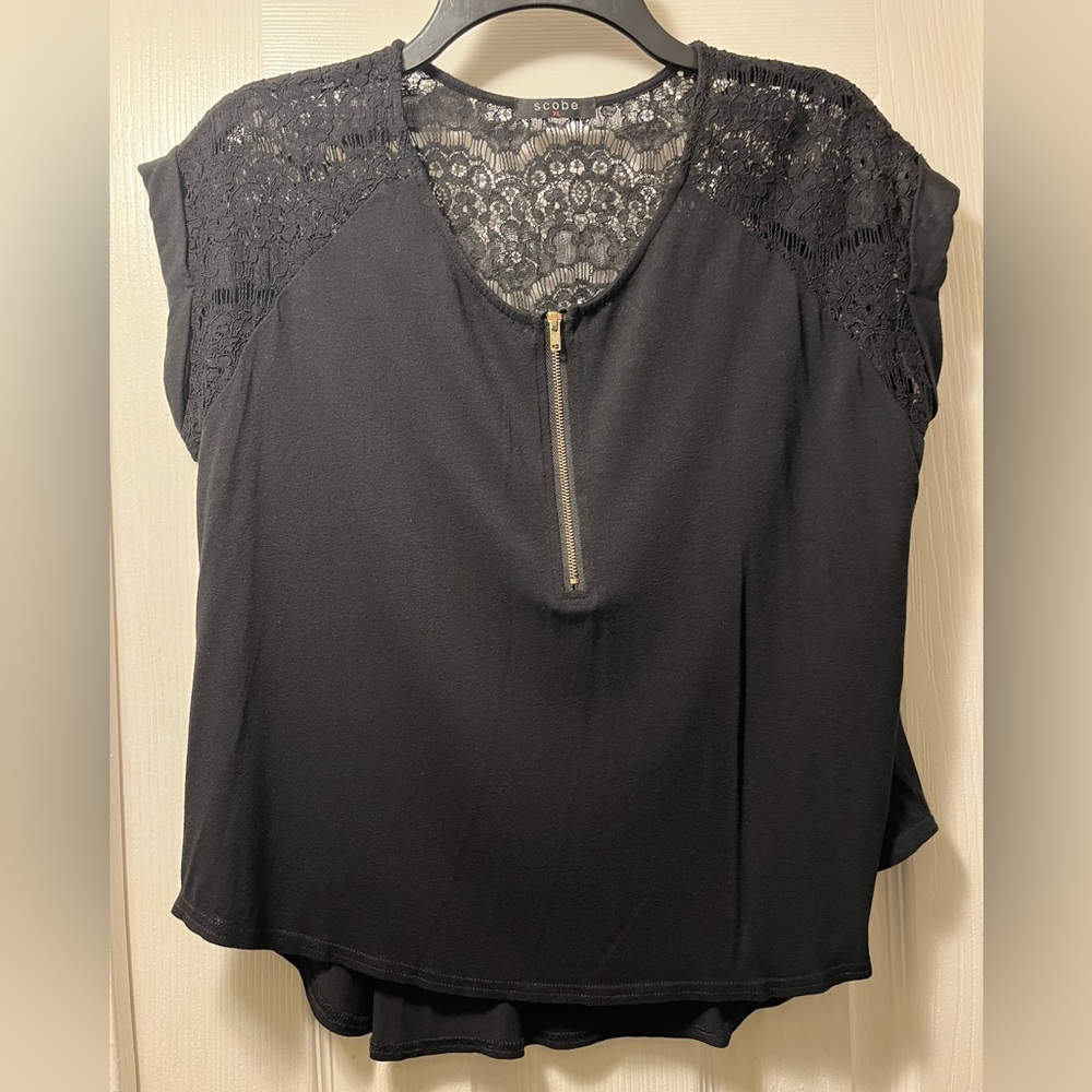 Black short sleeve top with lacey back detail